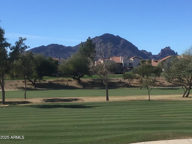 view of home's community featuring a yard and a mountain view