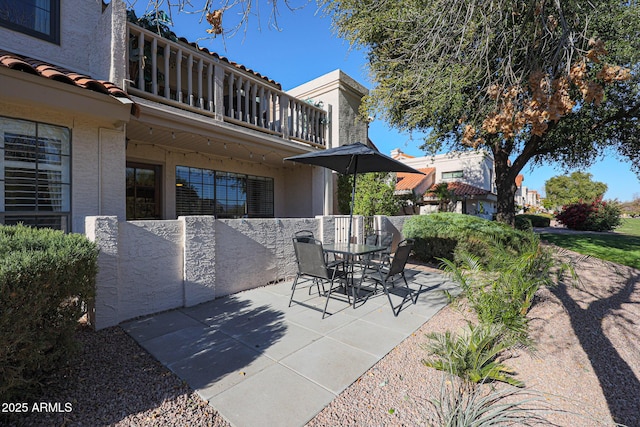 view of patio / terrace with a balcony