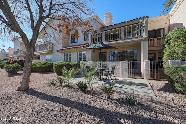 rear view of property with a patio