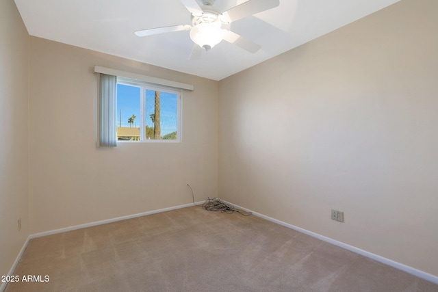 carpeted empty room with ceiling fan