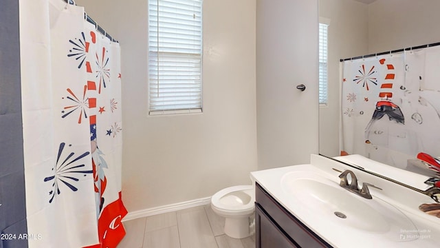 bathroom featuring vanity, plenty of natural light, curtained shower, and toilet