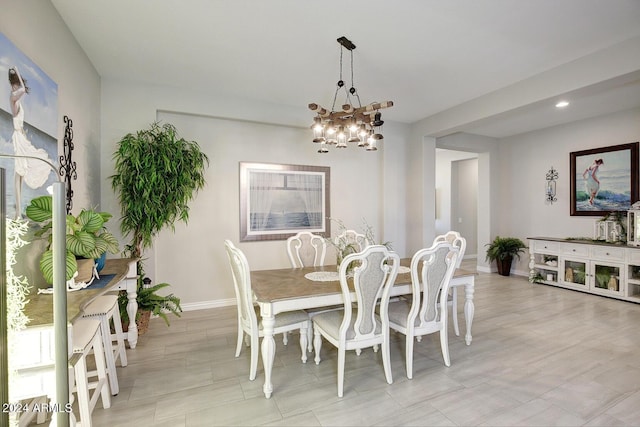 dining space with a chandelier