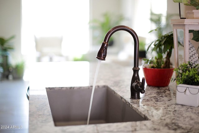 interior details with light stone counters and sink