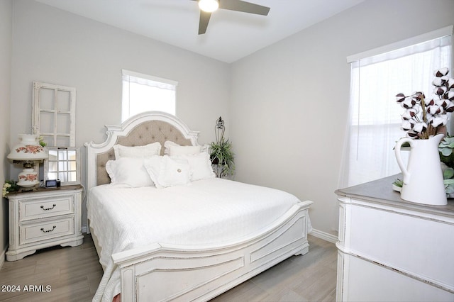 bedroom featuring dark hardwood / wood-style floors and ceiling fan