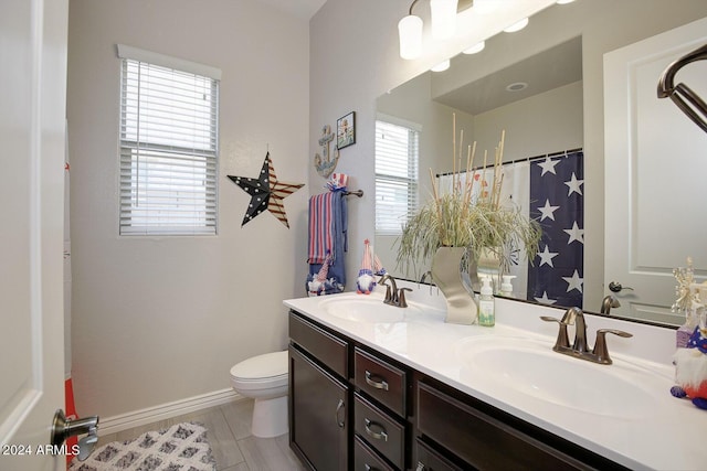 bathroom with vanity and toilet