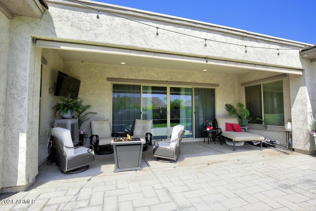 view of patio featuring a fire pit