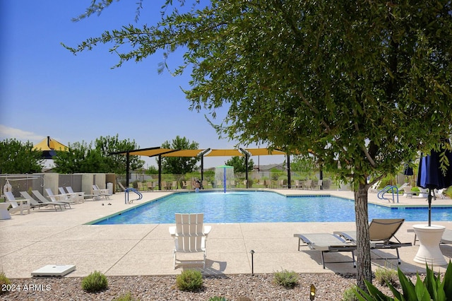 view of pool with pool water feature and a patio area