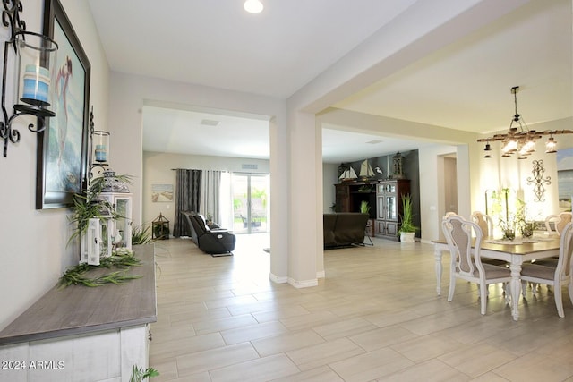 dining area featuring an inviting chandelier