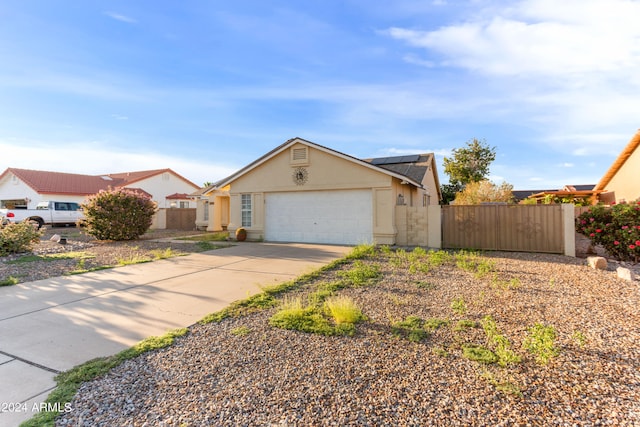 ranch-style home with a garage