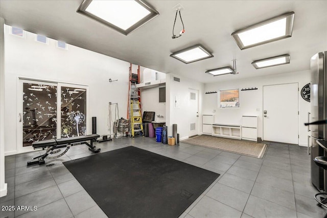 interior space with tile patterned floors and visible vents