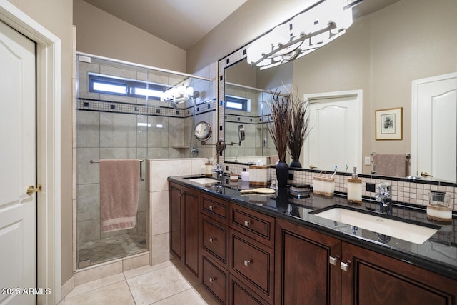 3394 N 147th Ln, Goodyear, AZ 85395 - bathroom with a stall shower, double vanity, lofted ceiling, tile patterned flooring, and plenty of natural light