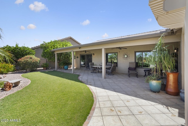3394 N 147th Ln, Goodyear, AZ 85395 - back of house with a ceiling fan, stucco siding, and a patio