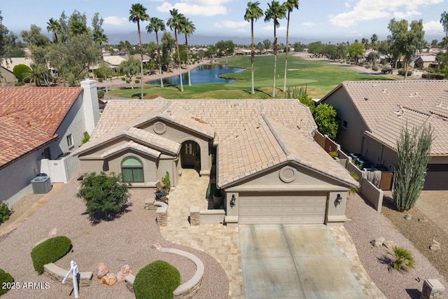 3394 N 147th Ln, Goodyear, AZ 85395 - ranch-style house featuring central AC unit, a water view, view of golf course, a garage, and driveway