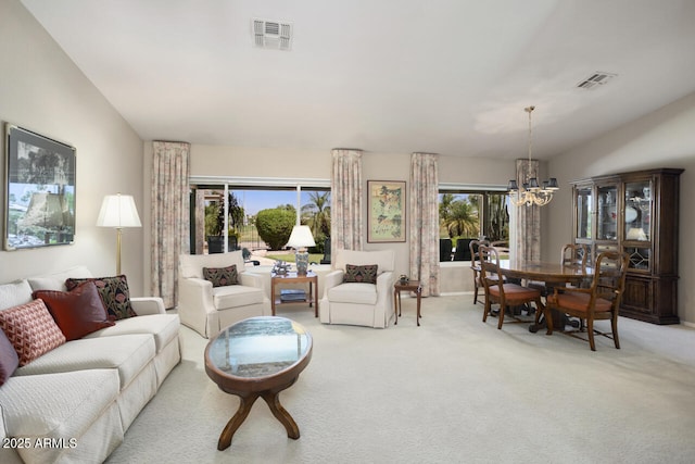 3394 N 147th Ln, Goodyear, AZ 85395 - living room featuring a chandelier, carpet floors, healthy amount of natural light, and vaulted ceiling
