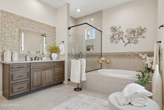 6450 E Monterra Way, Scottsdale, AZ 85266 - bathroom featuring a garden tub, a stall shower, vanity, tile patterned flooring, and tasteful backsplash