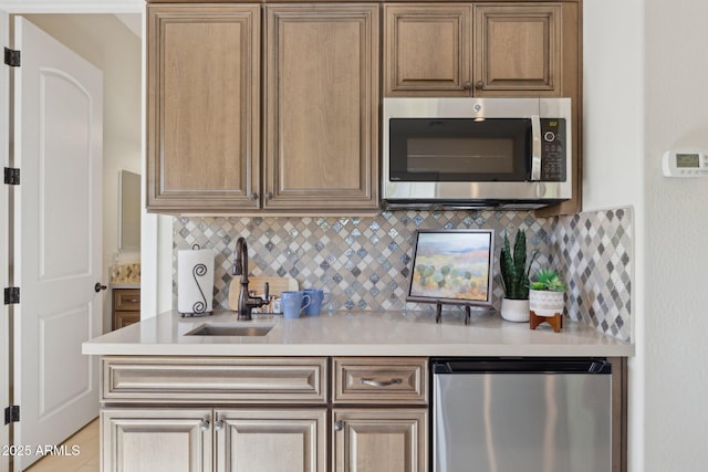 6450 E Monterra Way, Scottsdale, AZ 85266 - kitchen featuring stainless steel microwave, light countertops, and backsplash