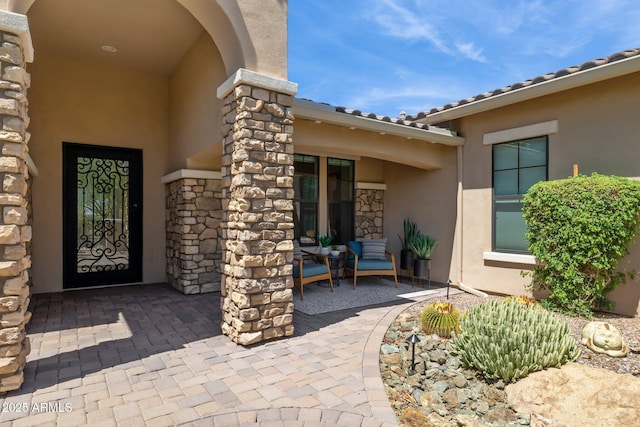 6450 E Monterra Way, Scottsdale, AZ 85266 - doorway to property with stucco siding and stone siding