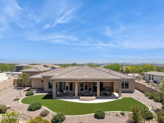6450 E Monterra Way, Scottsdale, AZ 85266 - rear view of house featuring a tiled roof, a fenced backyard, and stucco siding