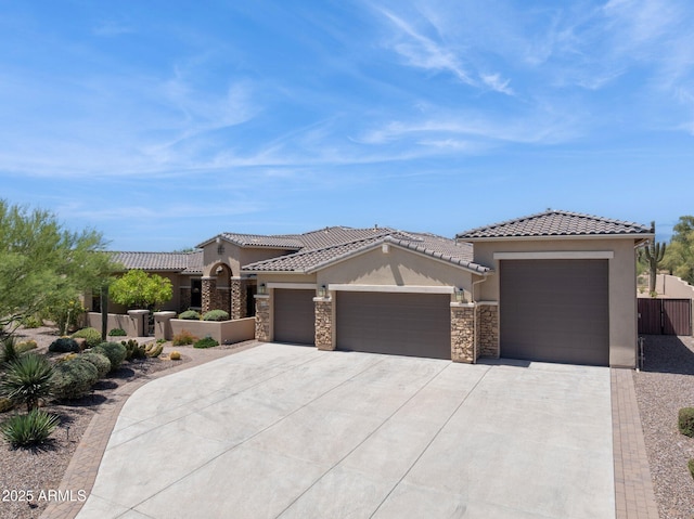 6450 E Monterra Way, Scottsdale, AZ 85266 - view of front of property featuring stucco siding, an attached garage, stone siding, concrete driveway, and a tile roof