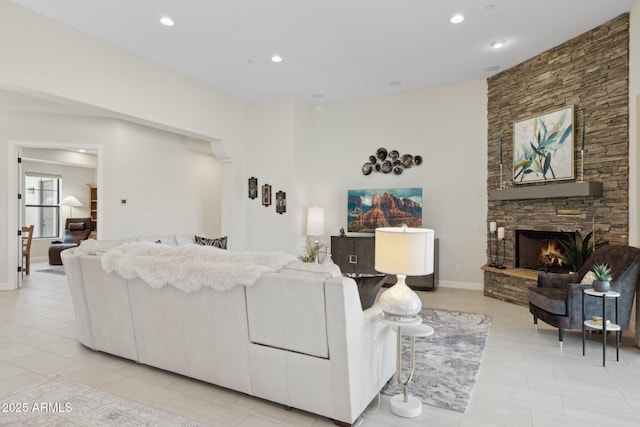 6450 E Monterra Way, Scottsdale, AZ 85266 - living room featuring a fireplace, recessed lighting, and light tile patterned floors