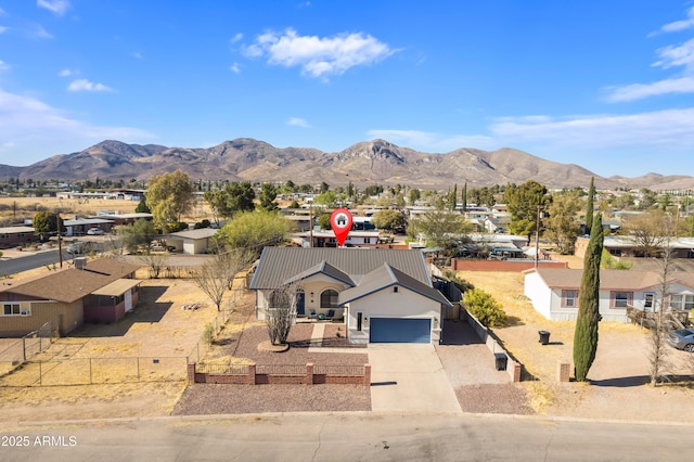 exterior space with a residential view and a mountain view