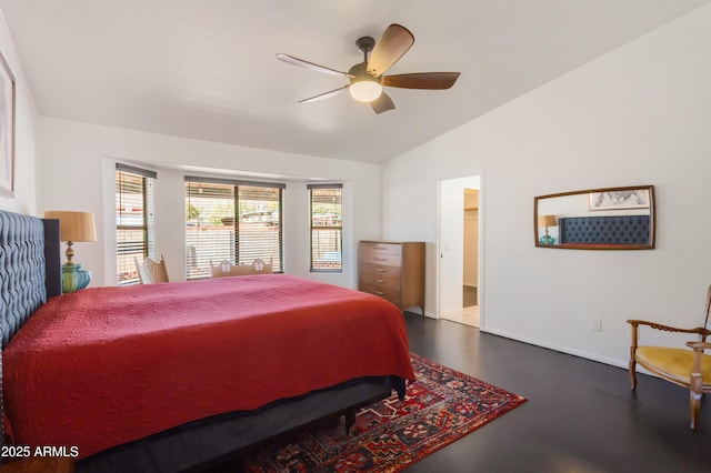 bedroom featuring baseboards, a ceiling fan, and vaulted ceiling