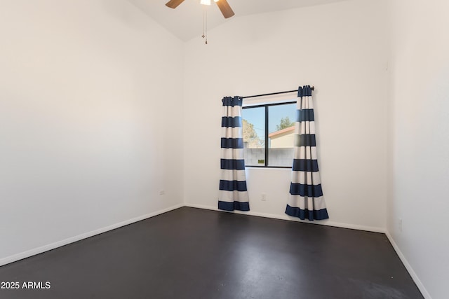 empty room featuring ceiling fan, baseboards, and lofted ceiling