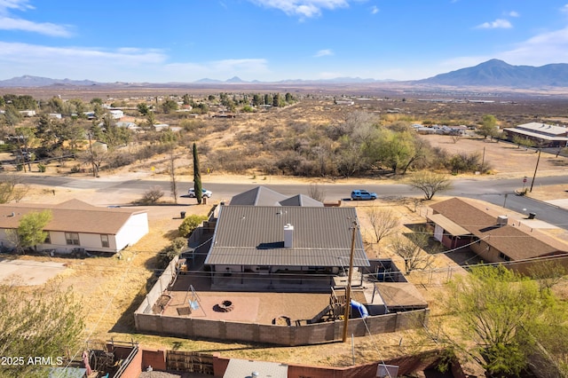 birds eye view of property with a mountain view
