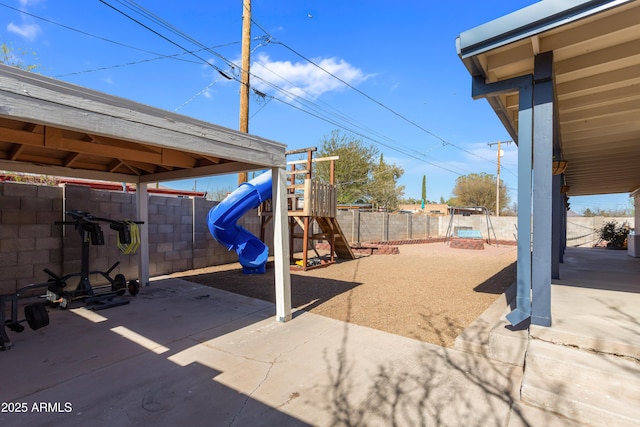 view of patio / terrace featuring a fenced backyard and a playground