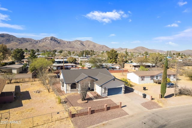 birds eye view of property featuring a mountain view and a residential view