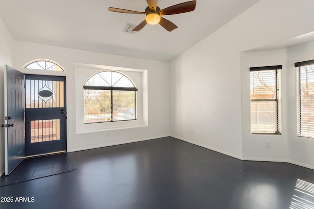 entryway featuring a healthy amount of sunlight, concrete flooring, ceiling fan, and visible vents