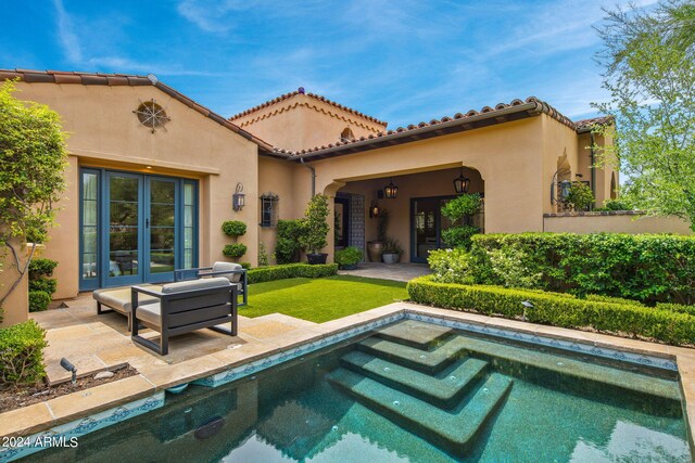 rear view of property with a patio