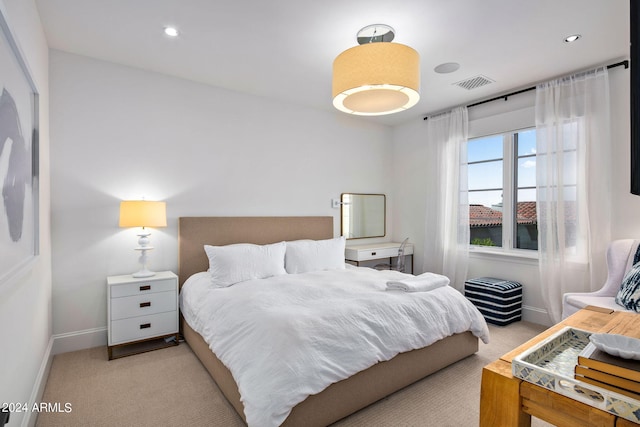 bedroom featuring light carpet, recessed lighting, visible vents, and baseboards