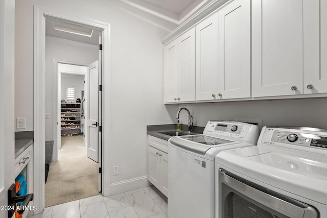 laundry area with separate washer and dryer, a sink, baseboards, marble finish floor, and cabinet space