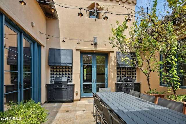 view of patio / terrace featuring outdoor dining area, area for grilling, and french doors