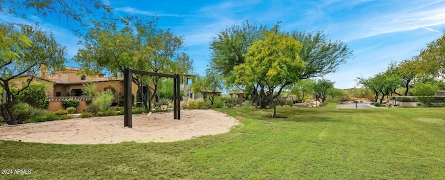 exterior space featuring a yard and volleyball court