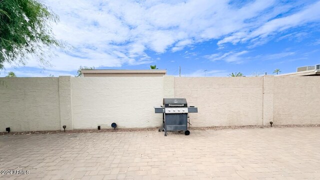 view of patio / terrace with a fenced backyard and area for grilling