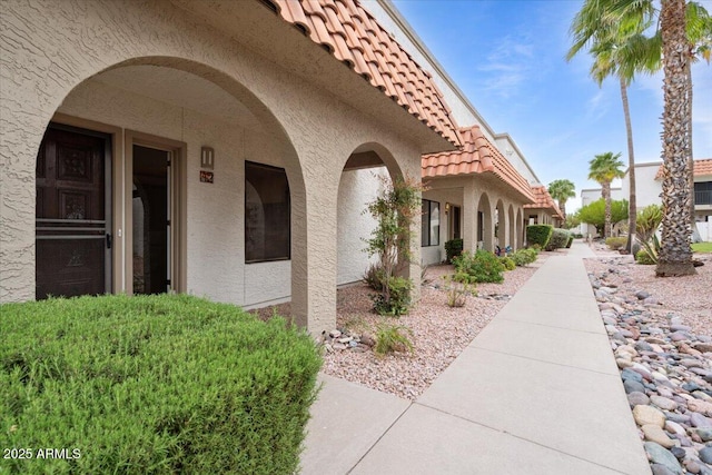 16510 E Palisades Blvd Unit 42, Fountain Hills, AZ 85268 - view of side of home with a tile roof and stucco siding