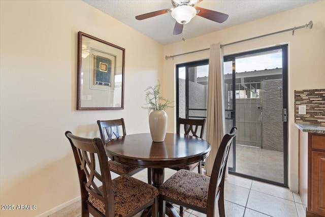 16510 E Palisades Blvd Unit 42, Fountain Hills, AZ 85268 - dining room with ceiling fan, light tile patterned floors, and baseboards