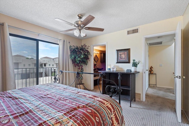16510 E Palisades Blvd Unit 42, Fountain Hills, AZ 85268 - carpeted bedroom featuring access to exterior, a textured ceiling, and a ceiling fan