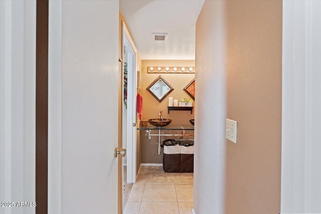 16510 E Palisades Blvd Unit 42, Fountain Hills, AZ 85268 - corridor featuring light tile patterned floors and baseboards