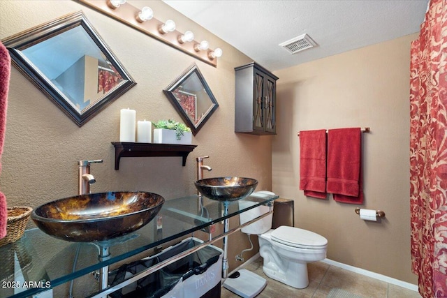 16510 E Palisades Blvd Unit 42, Fountain Hills, AZ 85268 - bathroom featuring a sink, tile patterned flooring, toilet, and baseboards