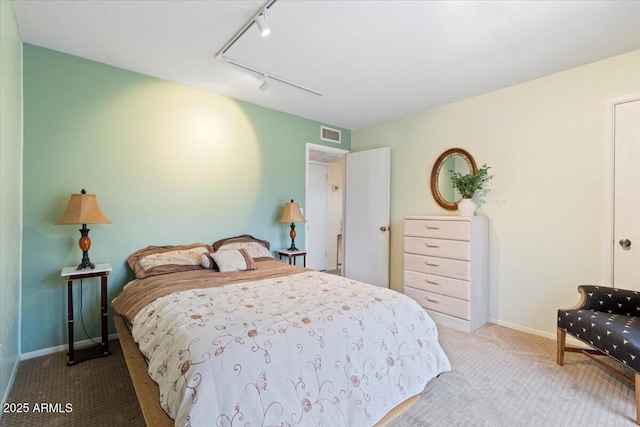 16510 E Palisades Blvd Unit 42, Fountain Hills, AZ 85268 - bedroom featuring rail lighting, carpet flooring, attic access, and baseboards