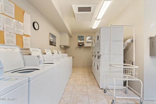 16510 E Palisades Blvd Unit 42, Fountain Hills, AZ 85268 - communal laundry room featuring stacked washer / dryer, washer and dryer, and light tile patterned floors