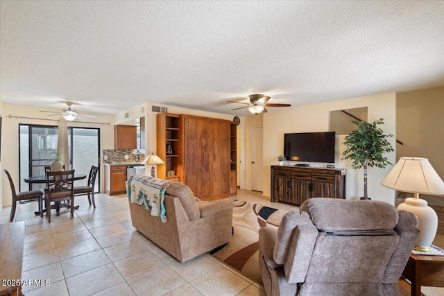 16510 E Palisades Blvd Unit 42, Fountain Hills, AZ 85268 - living area featuring ceiling fan, a textured ceiling, and light tile patterned flooring