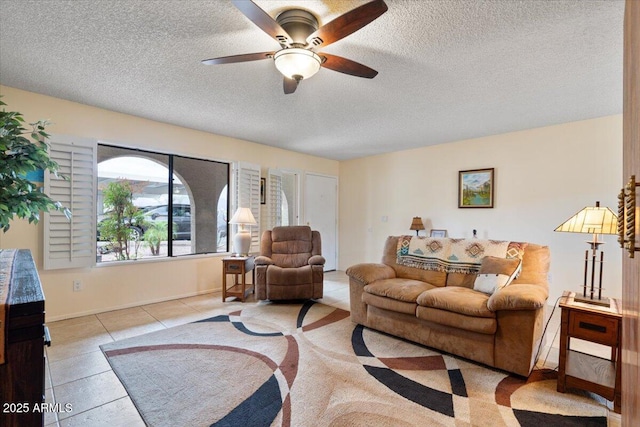 16510 E Palisades Blvd Unit 42, Fountain Hills, AZ 85268 - tiled living area with a textured ceiling, ceiling fan, and baseboards