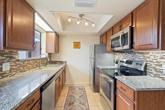16510 E Palisades Blvd Unit 42, Fountain Hills, AZ 85268 - kitchen with stainless steel appliances, a sink, light stone counters, and tasteful backsplash