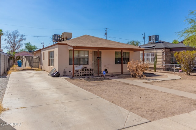 view of front of home with central AC and covered porch