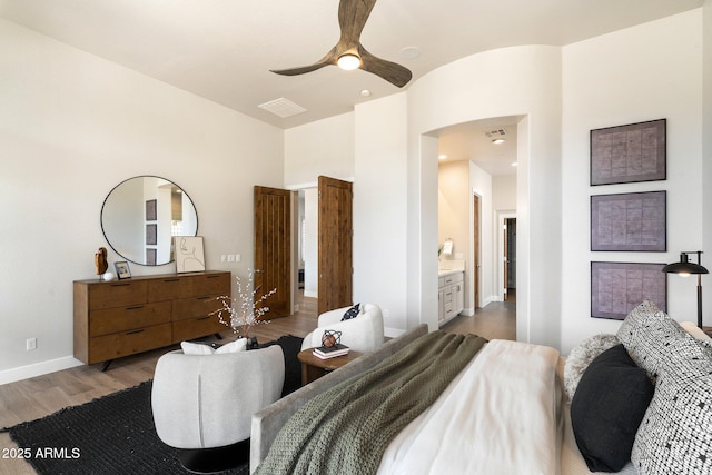 34599 N 99th Way, Scottsdale, AZ 85262 - bedroom featuring wood finished floors, a ceiling fan, and baseboards
