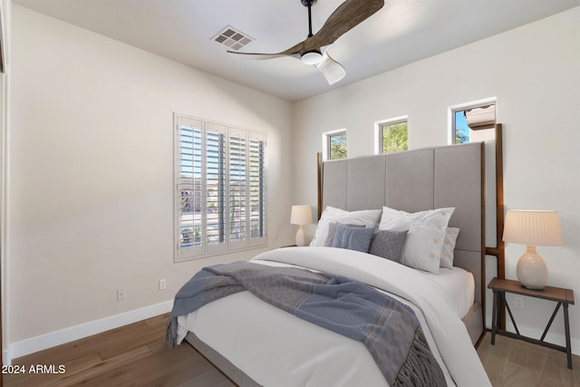 34599 N 99th Way, Scottsdale, AZ 85262 - bedroom with baseboards, wood finished floors, and ceiling fan